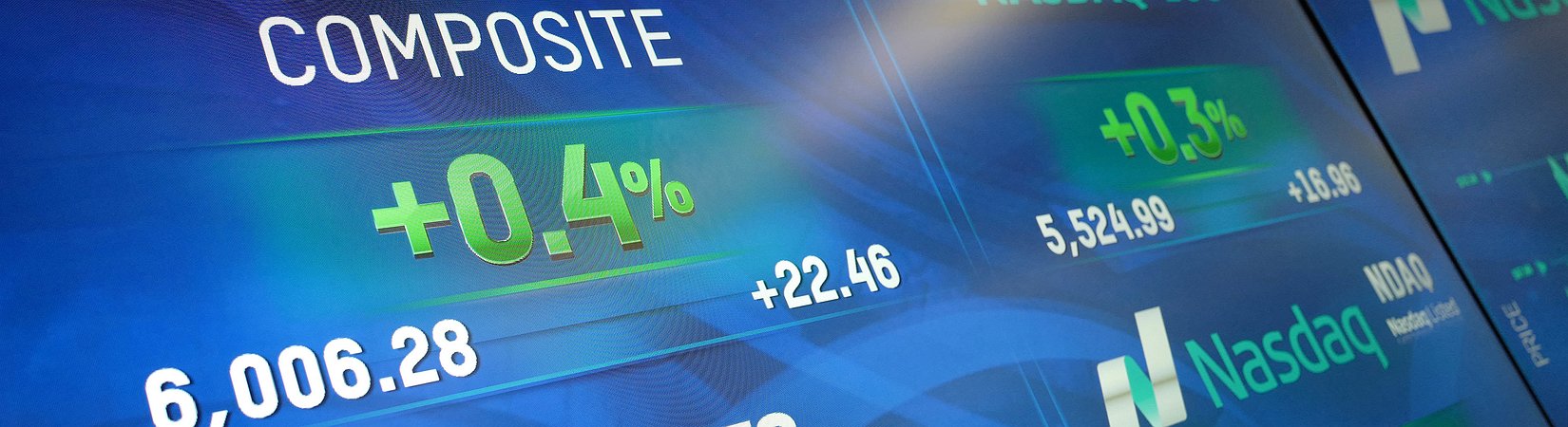 NASDAQ crosses 6000-point milestone